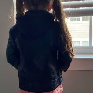 Gently used black leather jacket with a hood